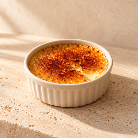 a small creme brulee with a cracked caramelized sugar surface