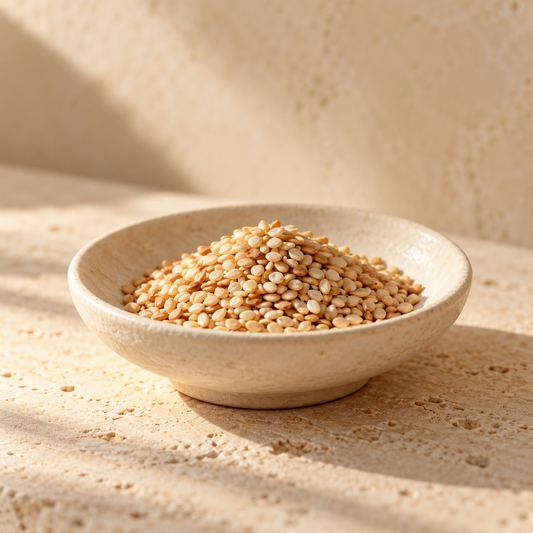 a small pile of sesame seeds in an ivory dish