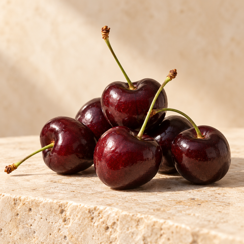very dark burgundy cherries with stems
