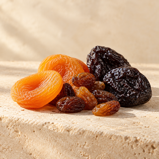 a small still life of dried apricot, raisin and prune