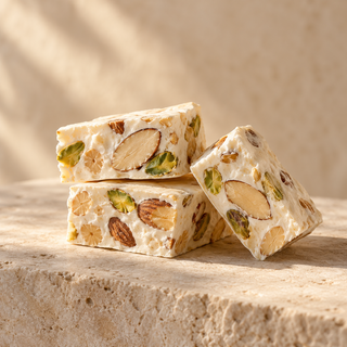 a few white nougat squares with visible nuts